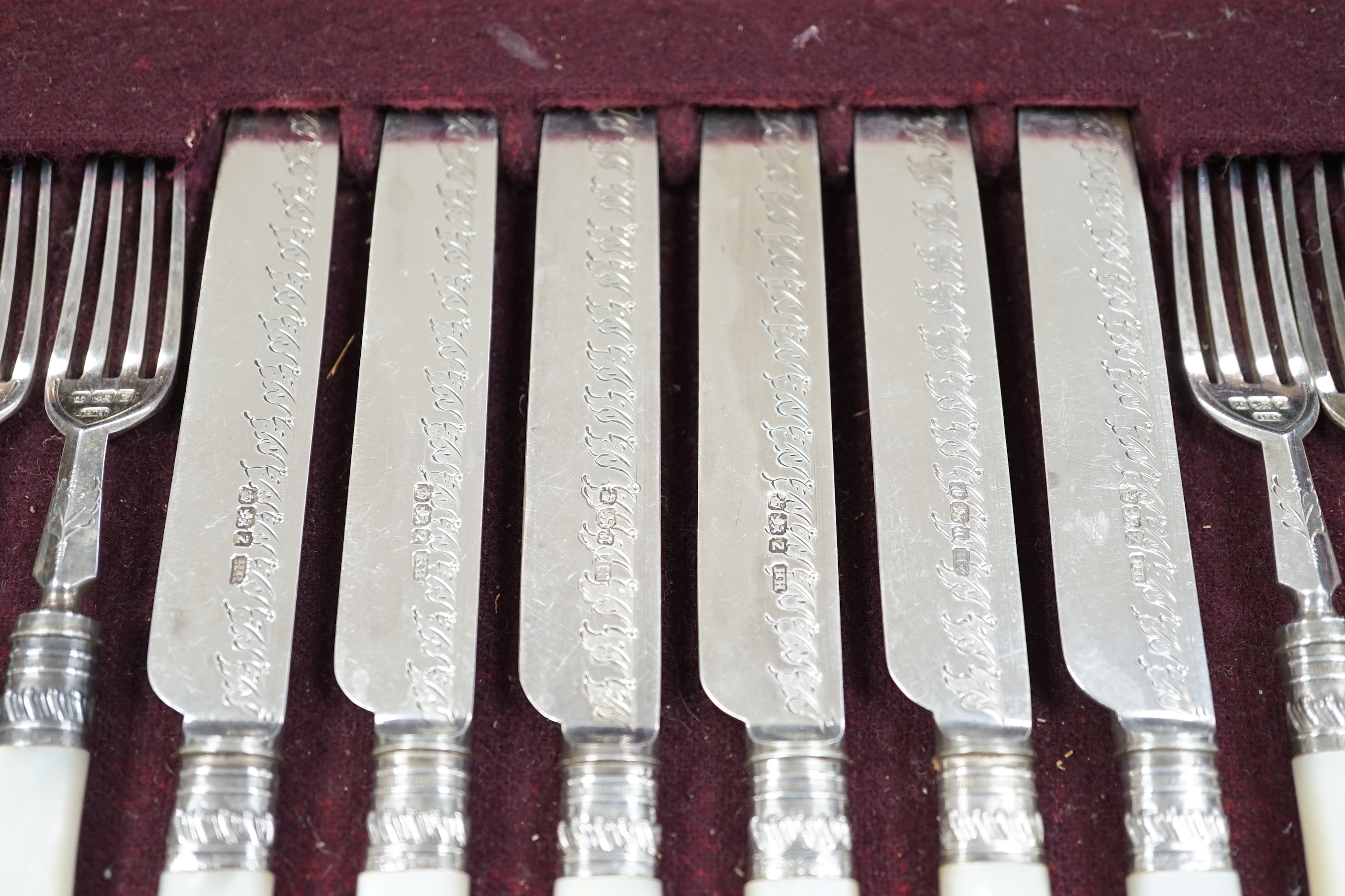 A cased set of twelve pairs of late Victorian mother of pearl handled silver dessert eaters, by Henry Harrison, Sheffield, 1892/3, knife 20cm.